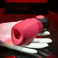 Body Kisses pink silicone suction toy resting on a display hand, showing textured exterior