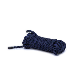 Bondage Couture navy blue twisted nylon rope coiled with black tipped ends