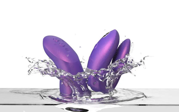 Both Chorus Pro purple silicone pieces splashing into water, showing waterproof capability