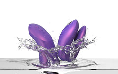 Both Chorus Pro purple silicone pieces splashing into water, showing waterproof capability