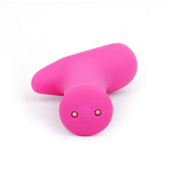 Bottom view of Ambi bullet vibrator showing dual magnetic charging contacts on rounded base