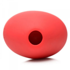 Bottom view of the Heart's Desire stimulator showing the circular suction opening in smooth red silicone