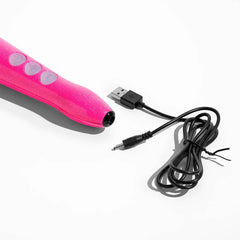 Bottom of pink wand massager with USB charging cable and barrel connector alongside