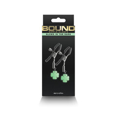 Bound Nipple Clamps G4 in dark retail packaging labeled Glows in the Dark by NS Novelties
