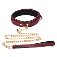 Burgundy velvet collar with black lining paired with gold chain leash and leather-wrapped handle