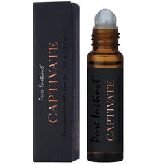 Captivate pheromone perfume oil roller bottle uncapped, showing silver ball applicator tip