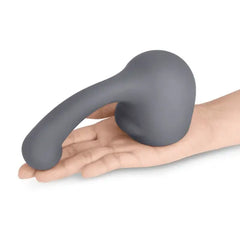 Charcoal grey Le Wand Curve silicone attachment resting in open palm for size reference