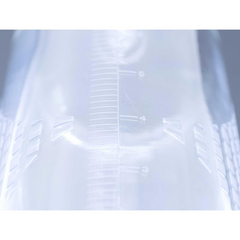 Close-up of clear cylinder interior showing embossed measurement ruler markings