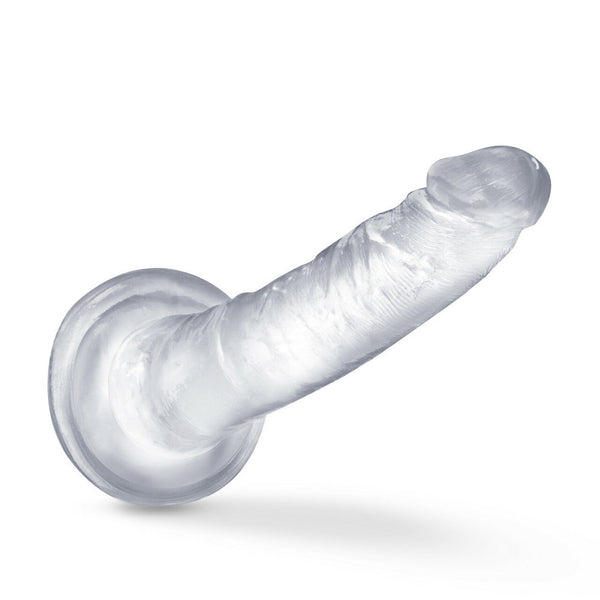 Clear realistic dildo displayed horizontally showing suction cup base and realistic texture