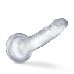 Clear realistic dildo displayed horizontally showing suction cup base and realistic texture