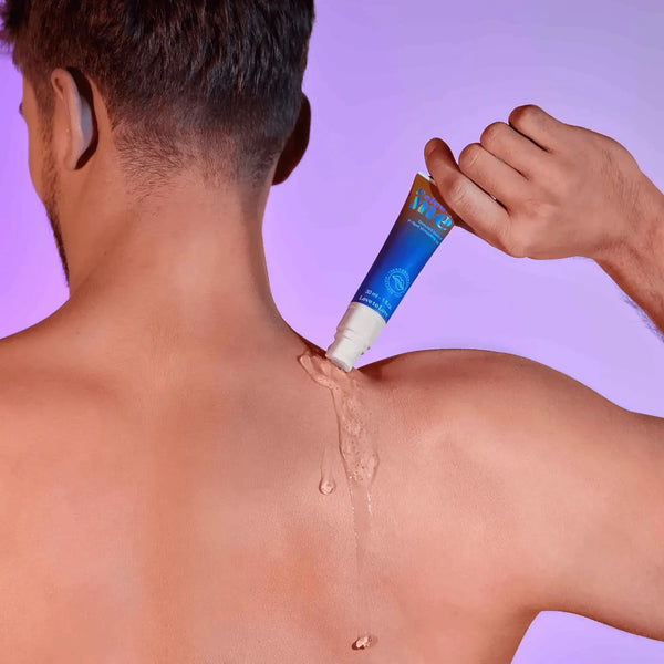Clear stimulating gel being dispensed from the Release Me tube onto a person's upper back