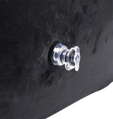 Close-up of clear twist-lock inflation valve on black microvelvet surface of positioner ramp