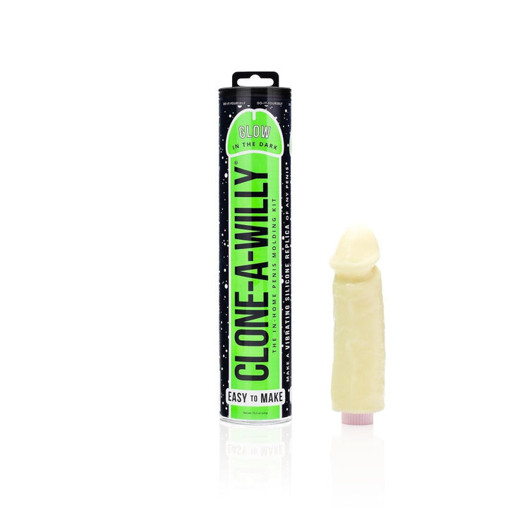 Clone A Willy Glow in the Dark kit beside its cylindrical tube packaging, cream silicone finish