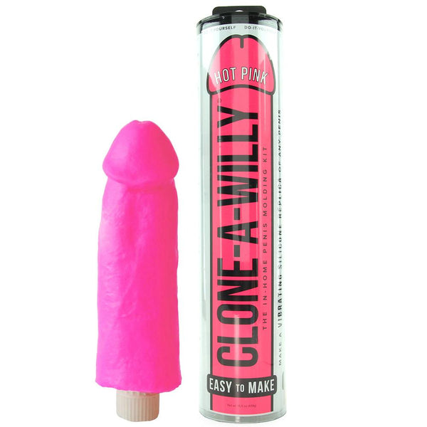Clone A Willy Hot Pink vibrating dildo beside its cylindrical tube packaging