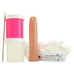 Clone A Willy molding kit components laid flat showing mixing cup, vibrator, silicone powder and thermometer