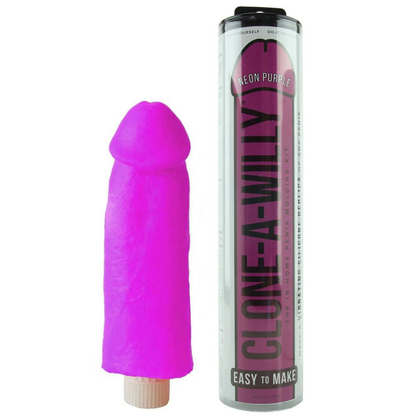 Clone A Willy Neon Purple vibrating dildo beside its clear cylindrical tube packaging