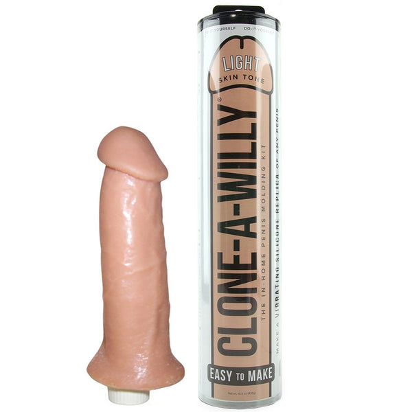Clone-A-Willy Original in light skin tone beside its cylindrical tube packaging