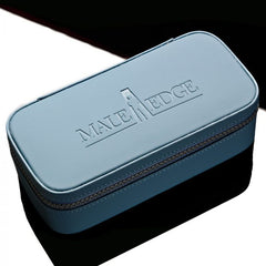 Closed blue faux-leather Male Edge storage case with debossed logo and silver zip trim
