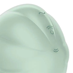 Close-up of Cloud Dancer control buttons with power and intensity icons on mint silicone