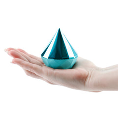 Compact teal Sugar Pop Jewel air pulse vibrator resting in an open palm, showing size