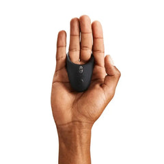 Compact We-Vibe Bond cock ring resting in an open palm to show its discreet size