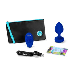 Complete b-Vibe jewel plug kit with remote, USB cable, storage pouch, and guide