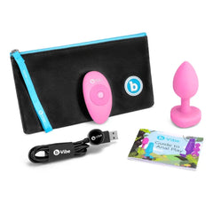 Complete b-Vibe set with plug, remote, USB cable, storage bag, and guide booklet