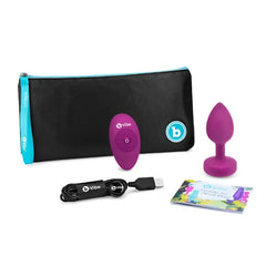 Complete b-Vibe set: plug, remote, USB cable, storage pouch, and anal play guide booklet