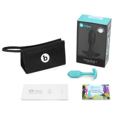 Complete b-Vibe Snug Plug 1 kit with storage bag, user guide, anal play booklet, and box