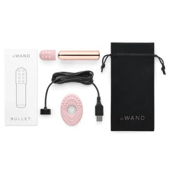 Complete Le Wand Bullet kit with bullet, sleeves, charging cable, and satin pouch