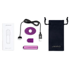 Complete Le Wand Bullet kit with bullet, two silicone attachments, USB charger, manual, and pouch