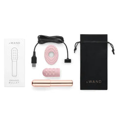 Complete Le Wand Grand Bullet kit with bullet, sleeves, charging cable, manual, and storage pouch