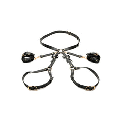 Complete STRICT Bondage Harness set laid flat showing waist belt, leg straps, and cuffs