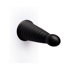 Cone dildo mounted vertically on flat surface showing progressive taper profile