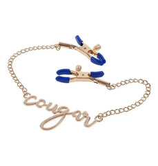 Cougar Nipple Clamps angled view showing blue rubber-tipped jaws and script charm detail on gold chain