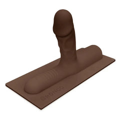 The Cowgirl Bronco chocolate brown silicone dildo attachment on flat mounting base, side angle
