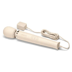 Cream Le Wand wand massager shown with full-length power cord and compact wall adapter