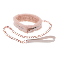 Close-up of cream leather fur-lined collar with rose gold buckle and chain leash detail
