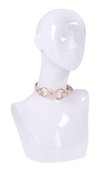 Cream and rose gold ring day collar displayed on white mannequin bust showing fit and proportions