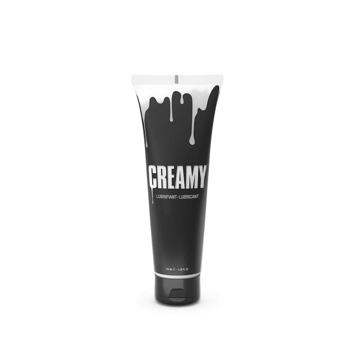 Creamy lubricant 150ml black tube with white drip design, flip-cap base, front view