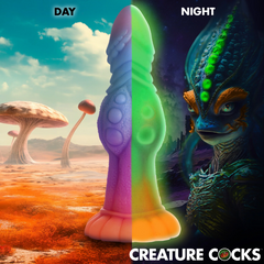 Creature Cocks Galactic Cock dildo shown in day colours versus glow-in-the-dark night mode