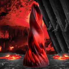Creature Cocks Hell Kiss silicone dildo in red and black swirl against dramatic cave backdrop