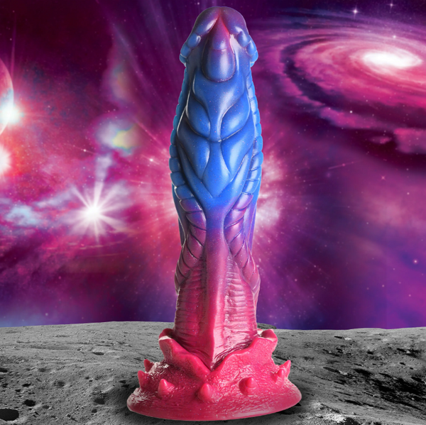 Creature Cocks Intruder alien silicone dildo in blue-to-pink gradient against galaxy backdrop