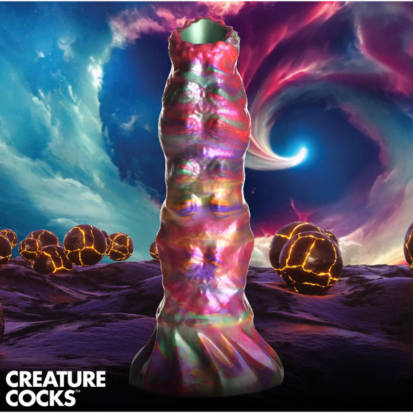 Creature Cocks Larva Ovipositor Silicone Dildo with iridescent multicolor finish against cosmic backdrop