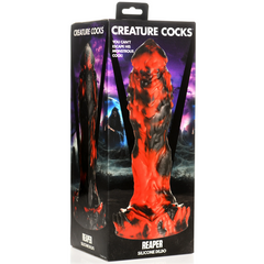 Creature Cocks Reaper Silicone Dildo displayed beside its gothic-themed retail box packaging
