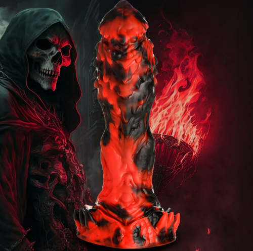 Creature Cocks Reaper Silicone Dildo in red and black beside a hooded skull figure