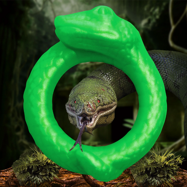 Creature Cocks Serpentine Silicone Cock Ring in bright green, coiled snake design against jungle backdrop