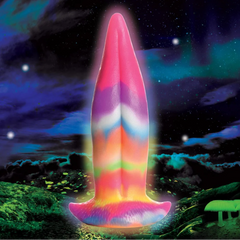 Creature Cocks Unicorn Kiss glow-in-the-dark silicone dildo glowing against a cosmic night sky