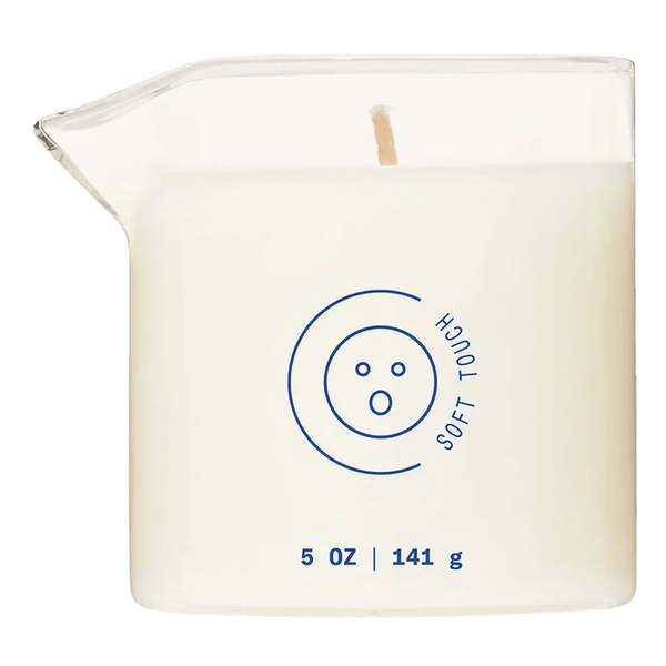 Dame Massage Oil Candle Soft Touch in clear square glass jar with wooden wick, 5 oz
