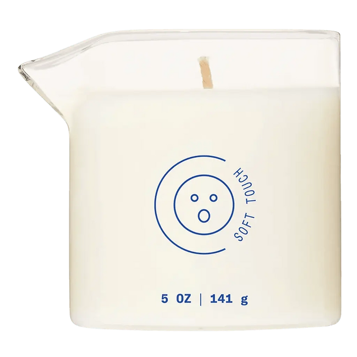 Dame Massage Oil Candle Soft Touch in clear square glass jar with wooden wick, 5 oz